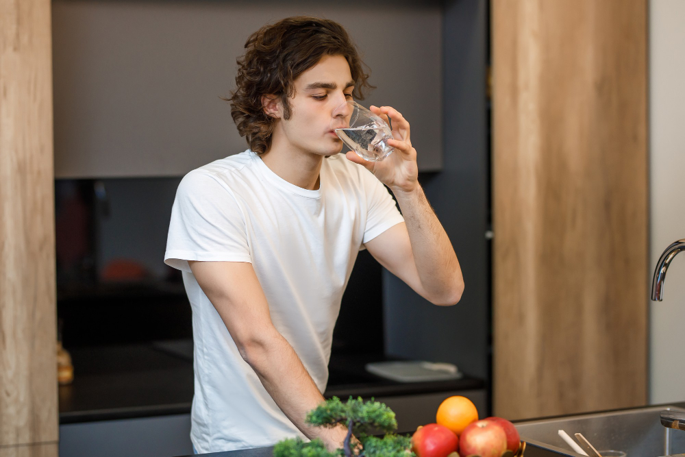Drink water frequently to stay hydrated in hot weather